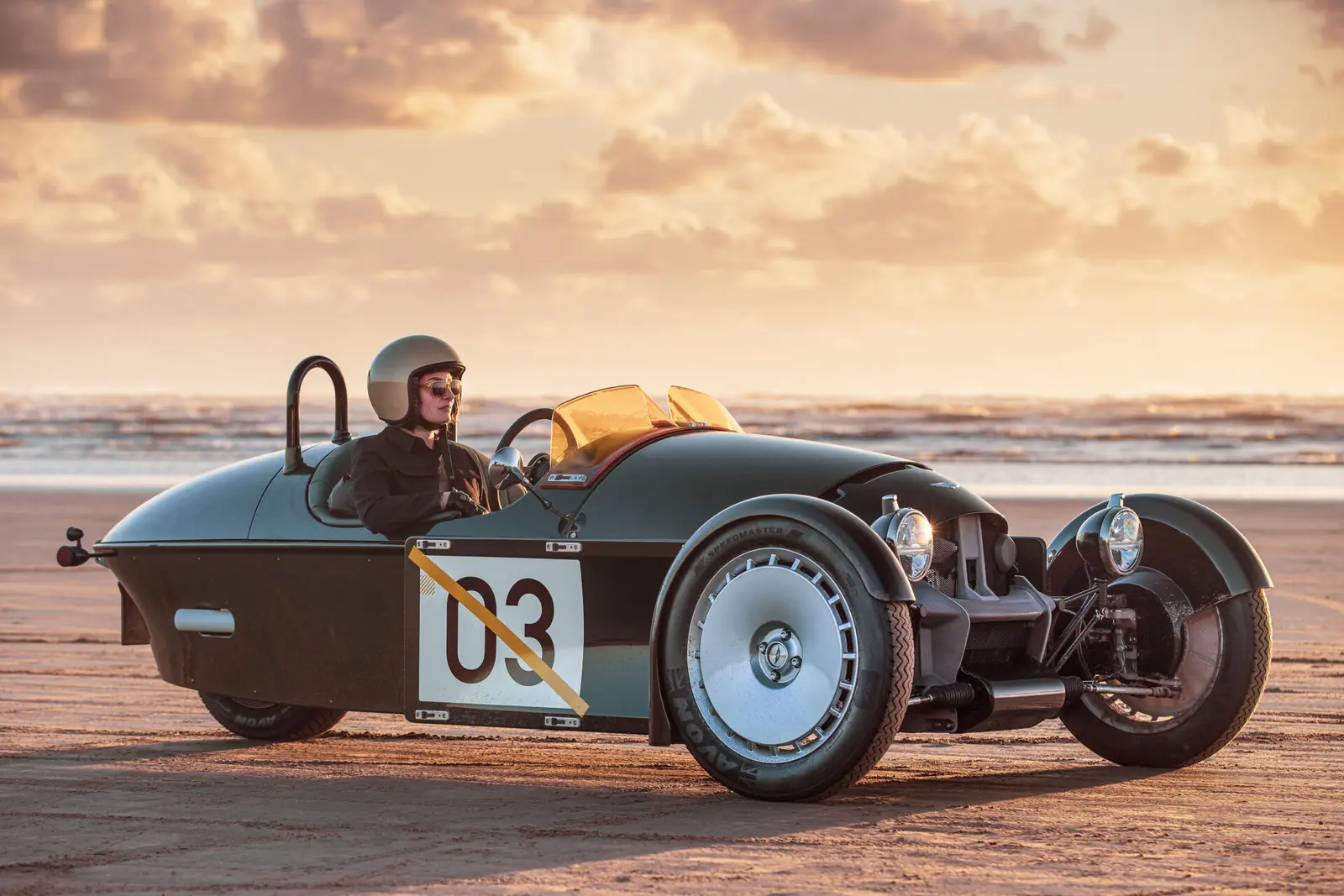 Morgan Super 3 on a beach at sunset